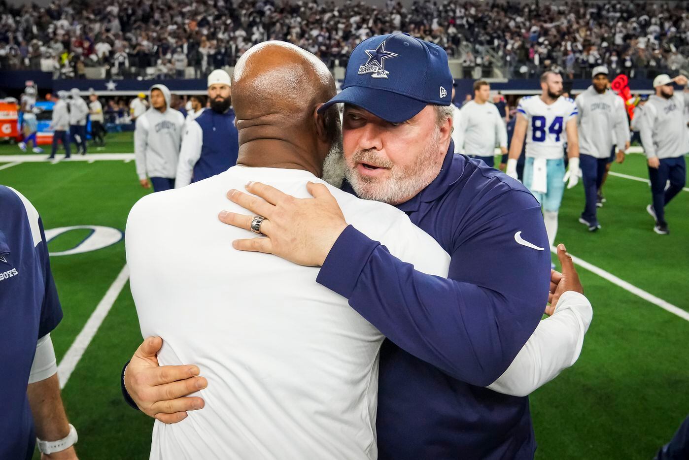 Dallas Cowboys head coach Mike McCarthy hugs Houston Texans head coach Lovie Smith after the...