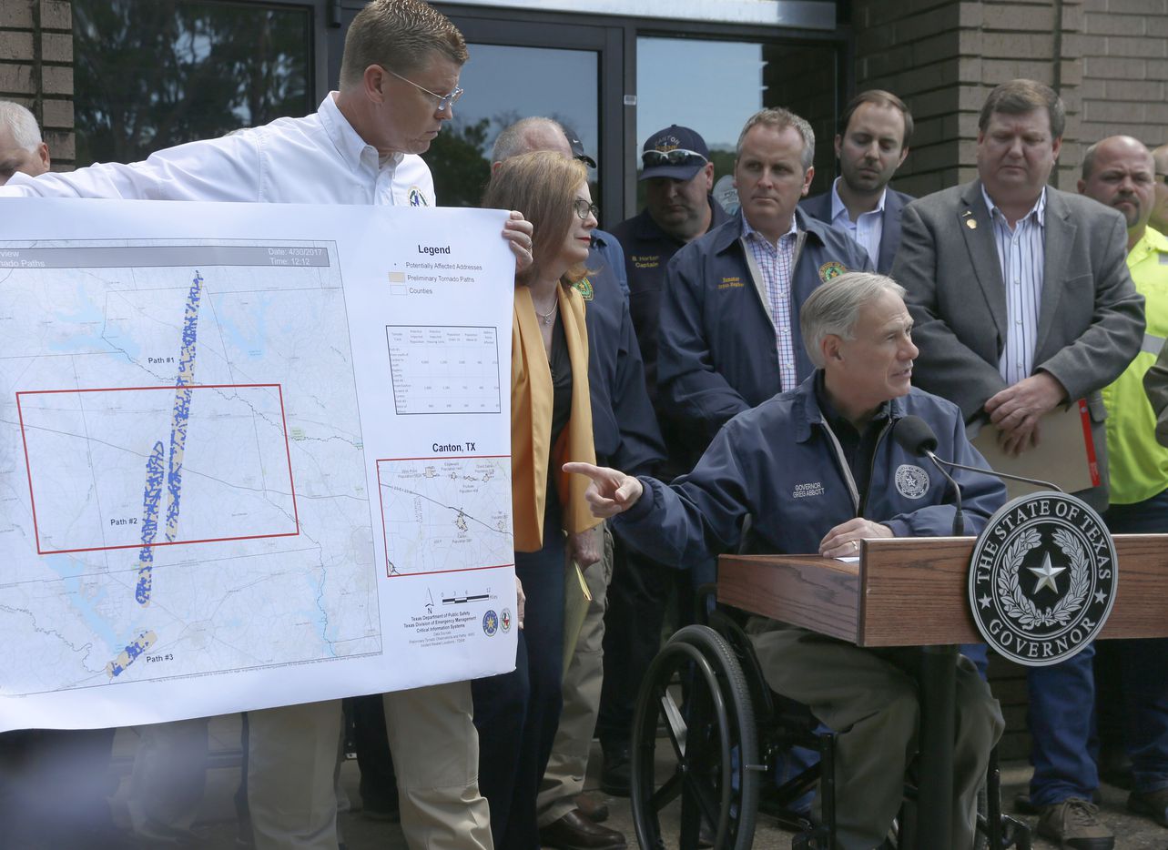 Texas Governor Greg Abbott shows the pathos the tornado'sthat touch down in east Texas near...