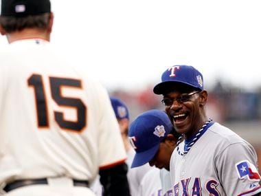 Texas Rangers manager Ron Washington shares a laugh with San Francisco Giants manager Bruce...