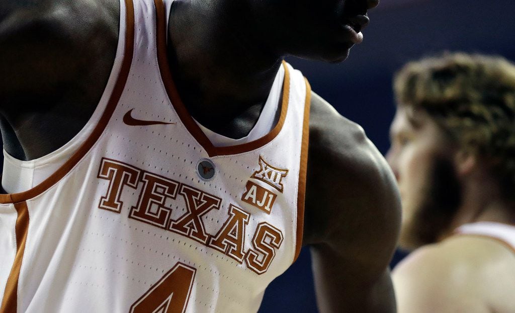 Texas forward Mohamed Bamba (4) wears an "AJ1" logo on his jersey during the first half of...