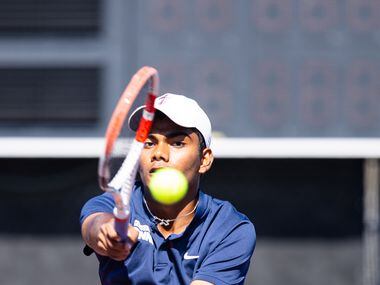 Frisco Centennial’s Aravind Sridhar returns a shot during a doubles match with partner...