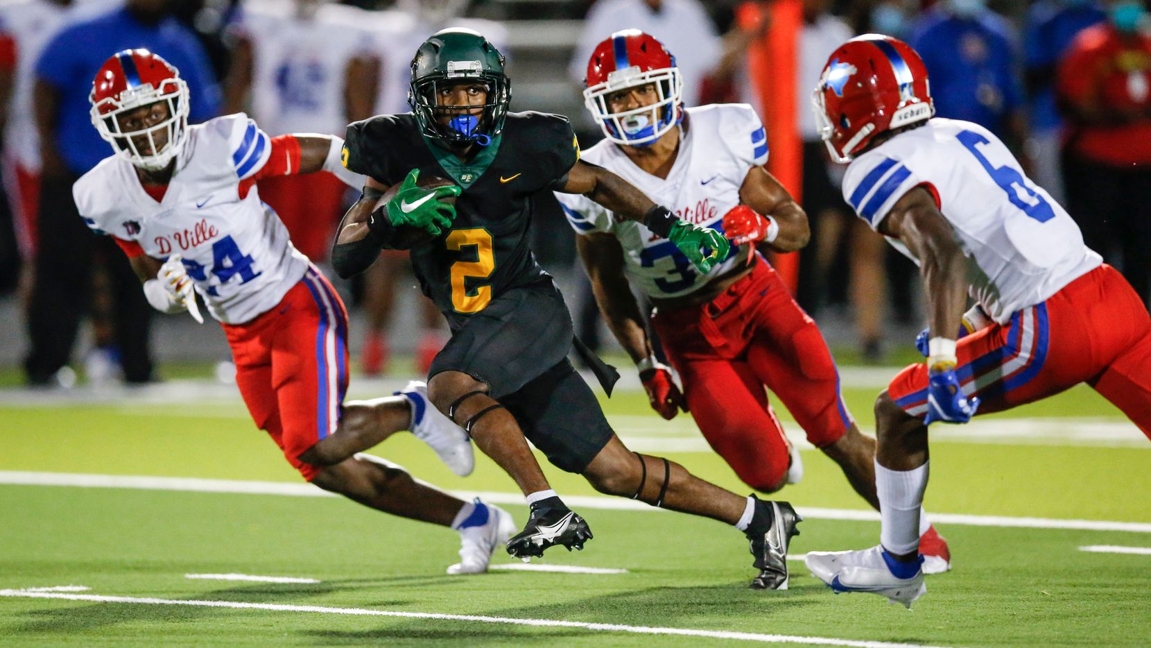 DeSoto senior wide receiver Mike Murphy (2) carries the ball against the Duncanville defense during the first half of a high school football game at DeSoto High School, Friday, September 17, 2021. (Brandon Wade/Special Contributor)
