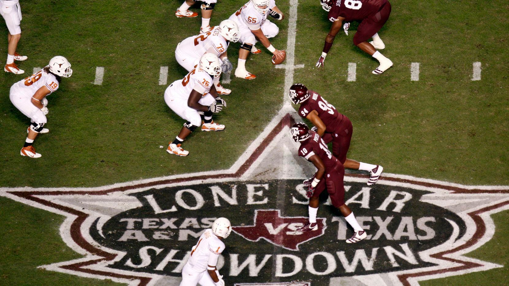 The Texas Longhorns and Texas A&M Aggies line up during their rivalry football game at Kyle...