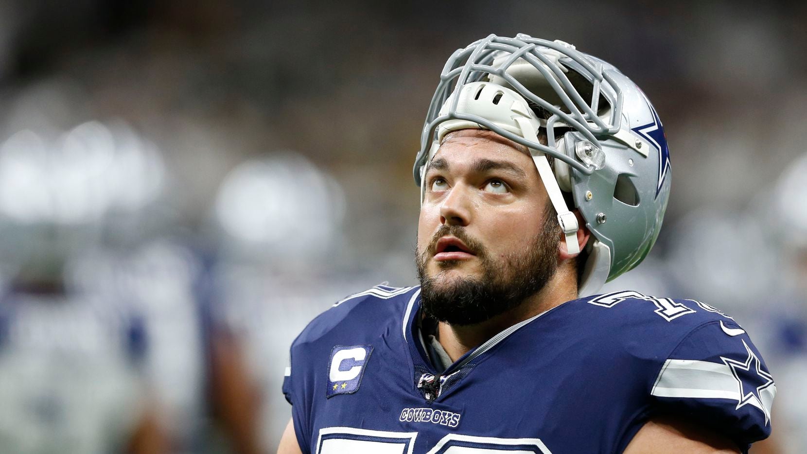 Dallas Cowboys offensive guard Zack Martin (70) looks up as he exits the field after warmups before a game against the New Orleans Saints at the Superdome in New Orleans, Louisiana on Sunday, September 29, 2019.