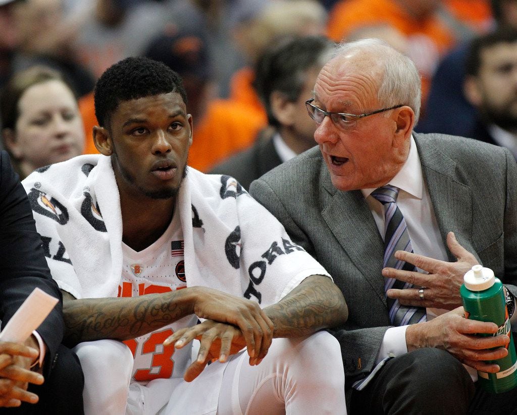 Syracuse head coach Jim Boeheim, right, talks with Syracuse's Frank Howard, left, on the...