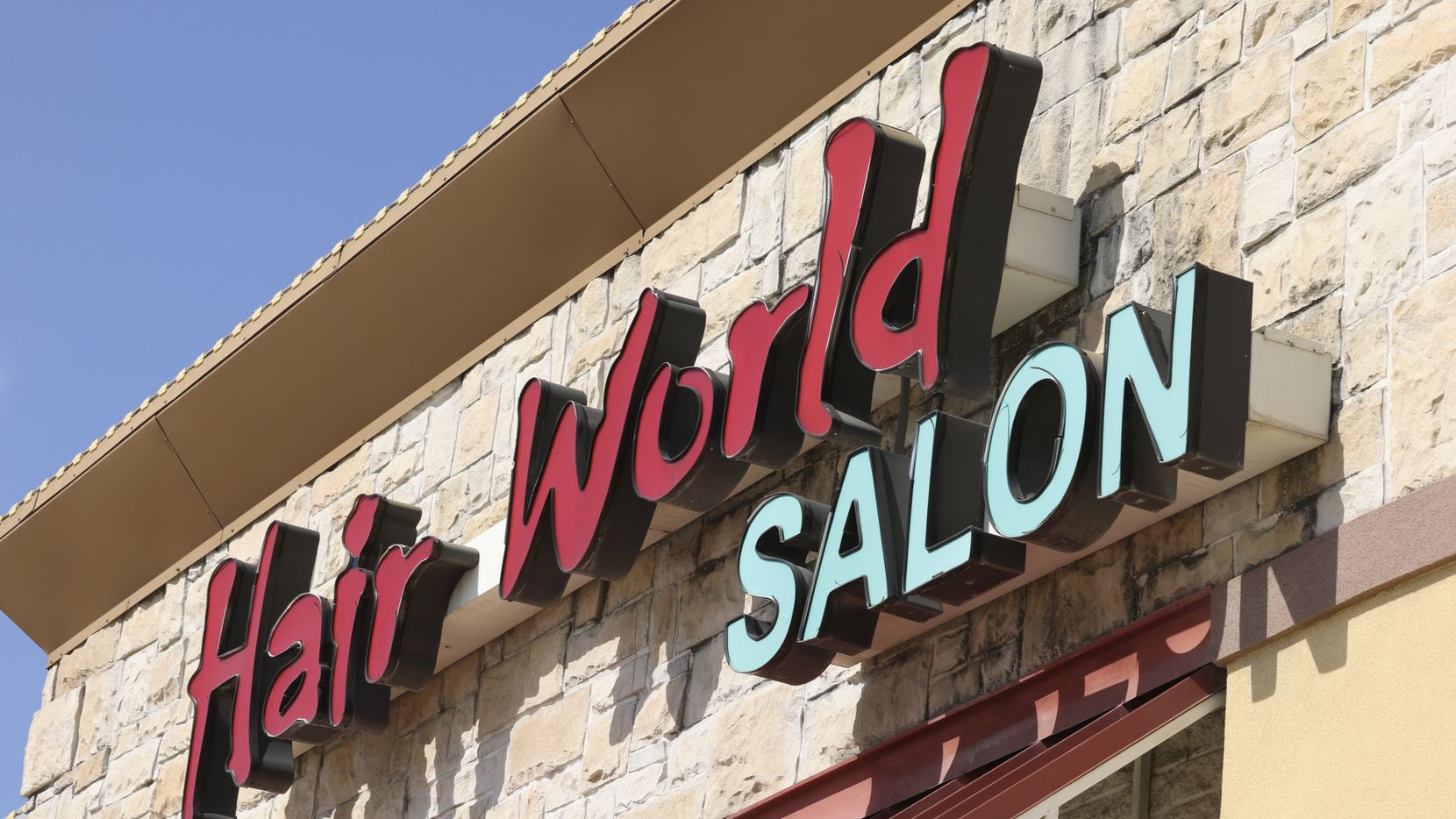 The exterior of Hair World Salon on May 12, 2022 in Dallas. Three Korean women were injured...