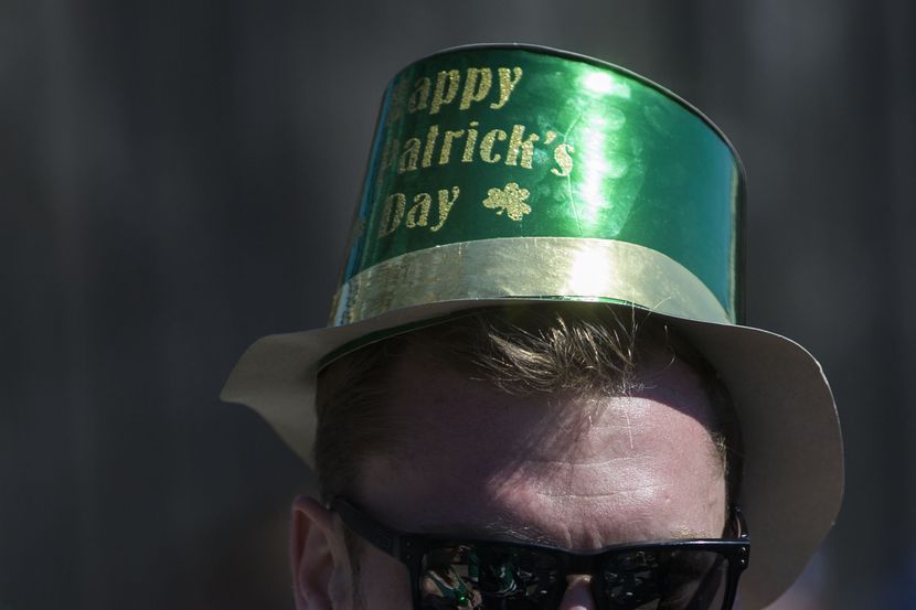 A man wearing a hat that says "Happy St. Patrick's Day"