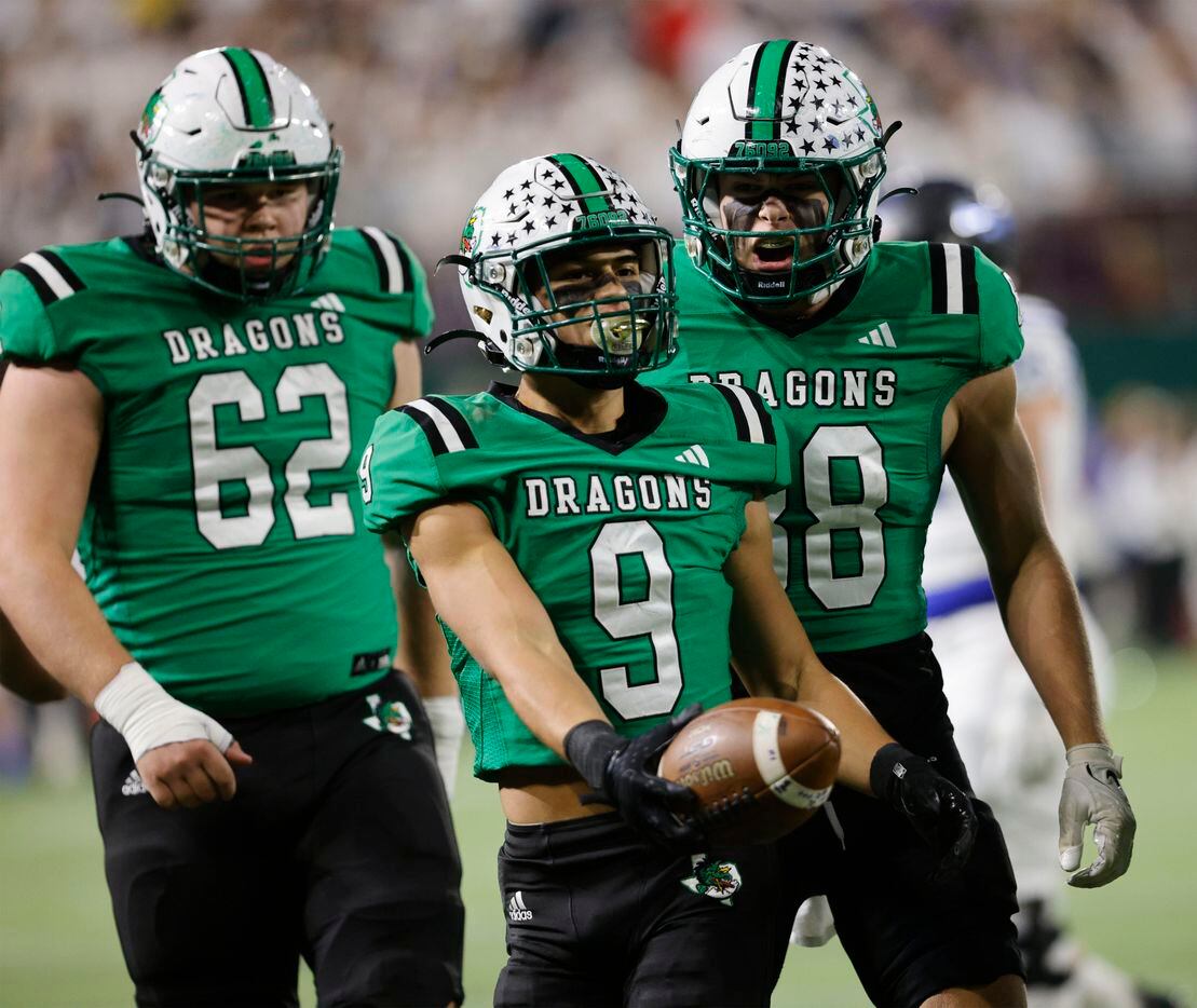 Southlake Carroll's Riley Wormley (9) celebrates with Southlake Carroll's Andrew Cunningham...