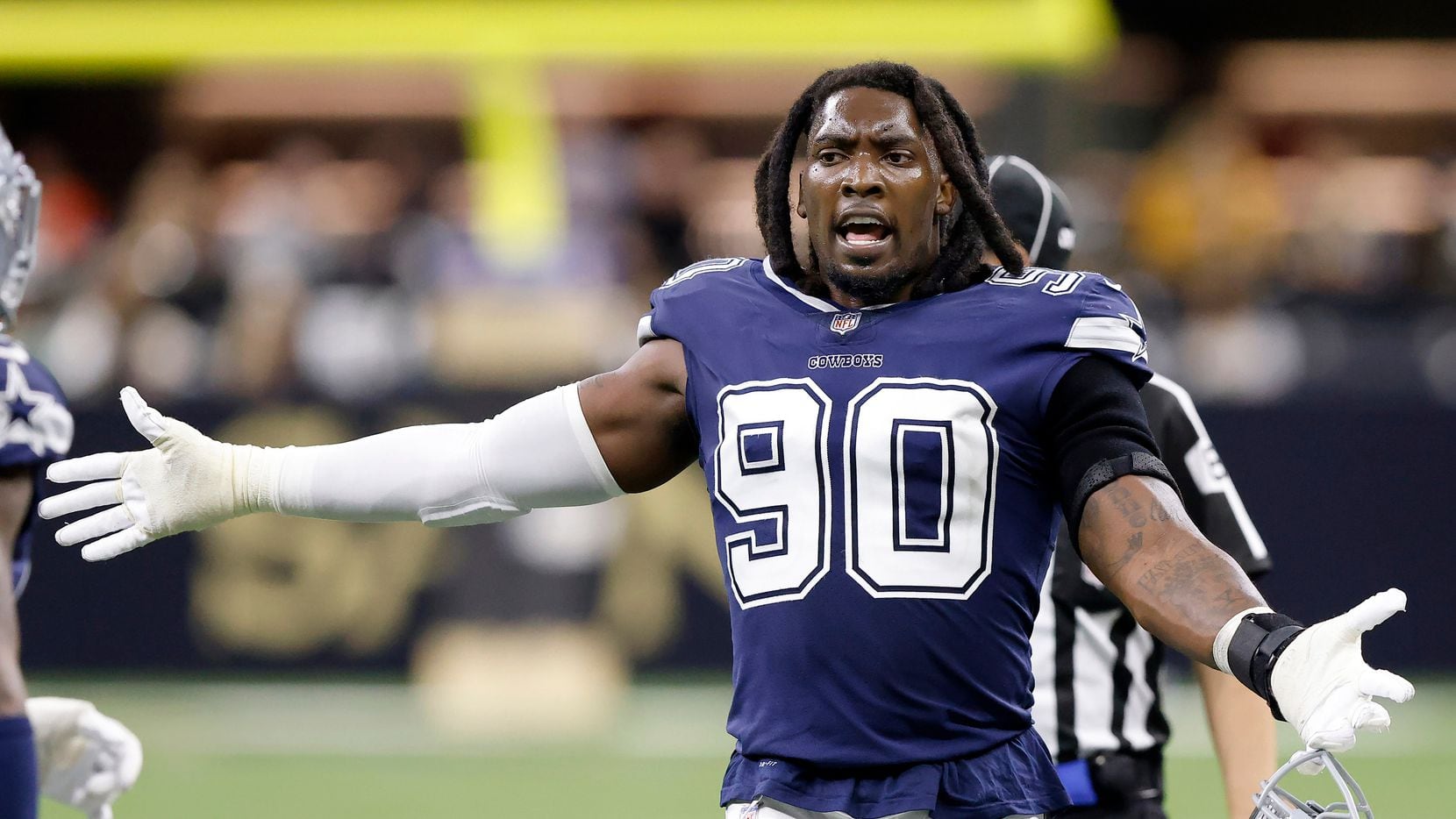 Dallas Cowboys defensive end Demarcus Lawrence (90) reacts to his teammates play during a fourth quarter turnover by the New Orleans Saints at the Caesars Superdome in New Orleans, Louisiana December 2, 2021.