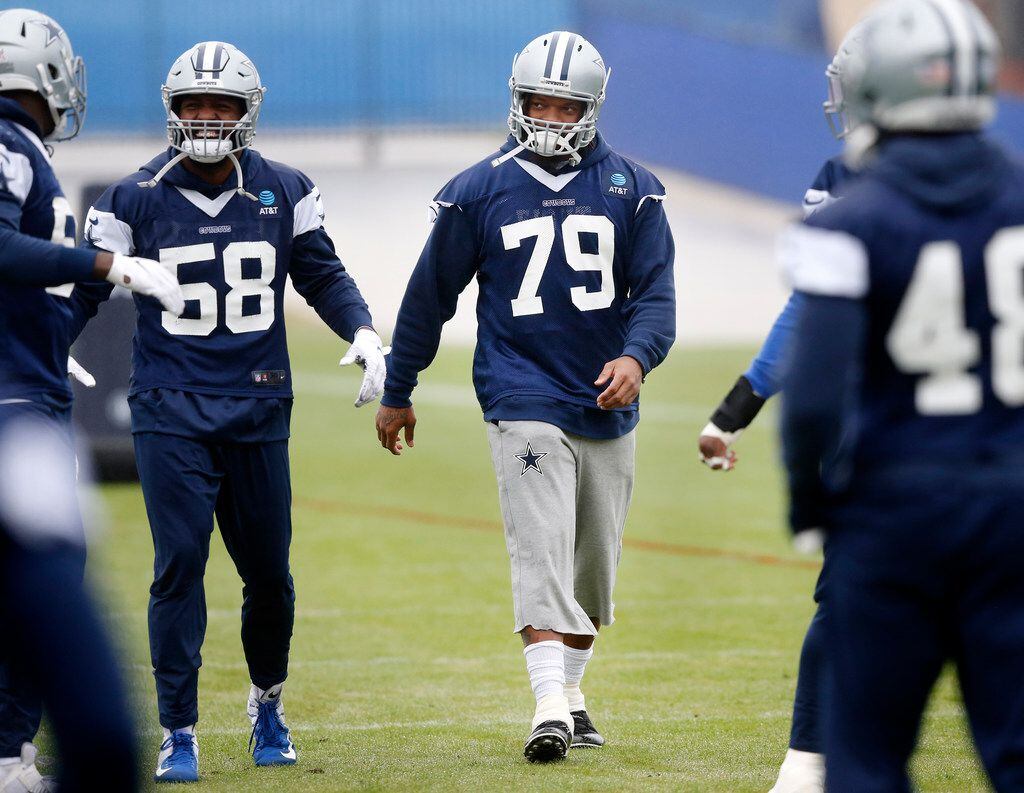 New Dallas Cowboys defensive end Michael Bennett Jr. (79) joins defensive end Robert Quinn (58) and his defense teammates for practice at The Star in Frisco, Tuesday, October 29, 2019. Bennett was cut by the New England Patriots and picked up by the Cowboys last week. (Tom Fox/The Dallas Morning News)