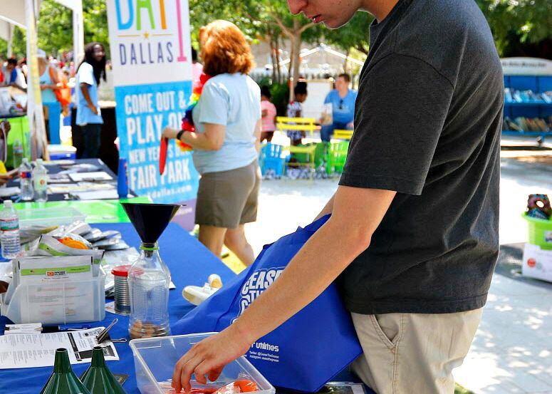 Wesley Huffman checks out volunteer opportunities at Voly in the Park at Kylde Warren Park. 