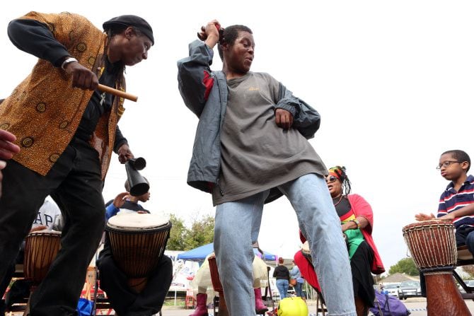 Pastor Clarence Glover Jr. (left) and Afiah Bey (second from right) participated in a drum...