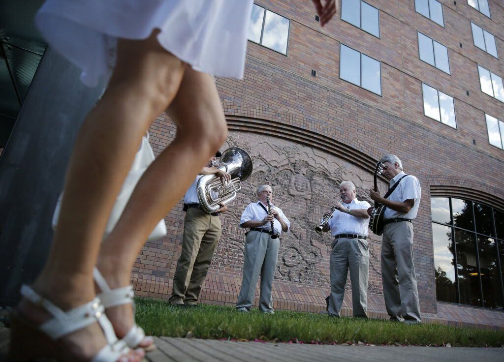 The Razzmajazz band plays for guests outside the Hilton Anatole, a rendezvous point for the...