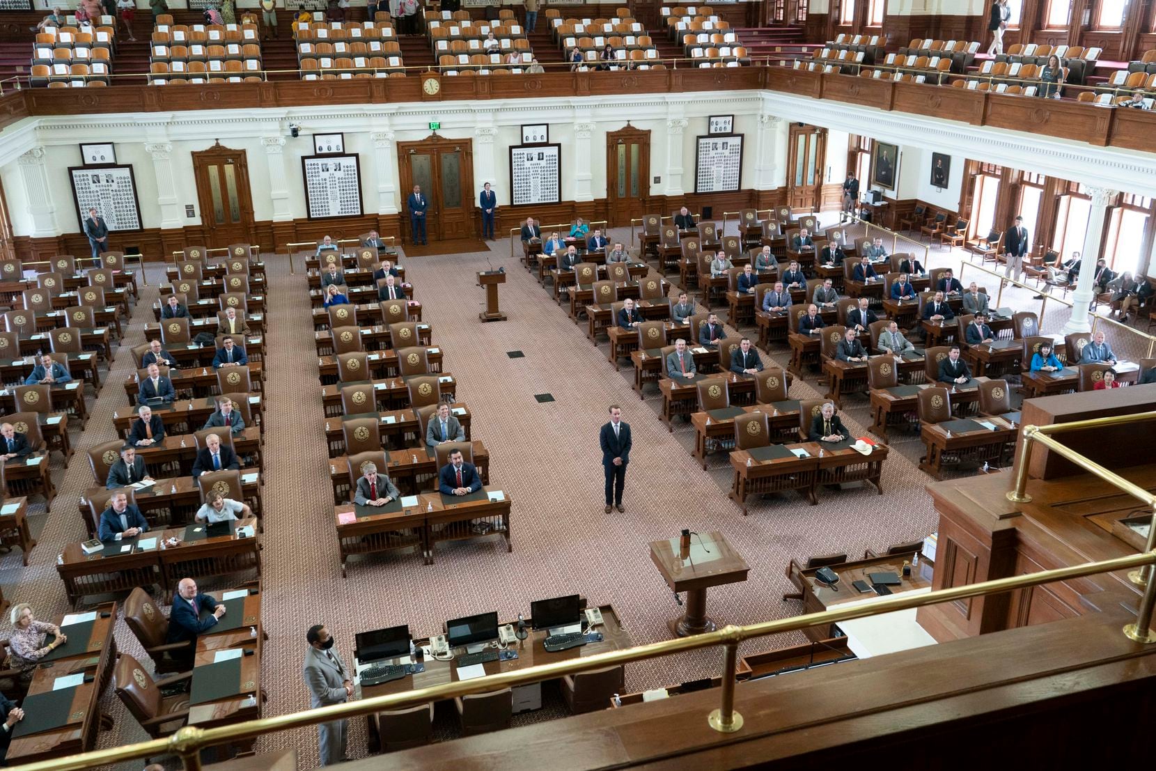 House Speaker Dade Phelan stood in the middle of the Texas House chamber as Republican members posed for a panorama on the second day of failing to get a quorum at a special session. Most Democratic members had left the state, protesting restrictive elections legislation.