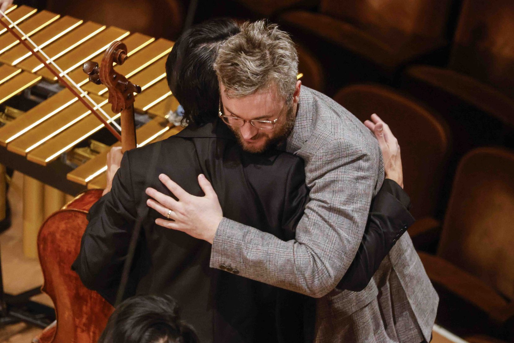 Composer Samuel Adams hugs cellist David Requiro after a performance of Adams' 'Sundial'...