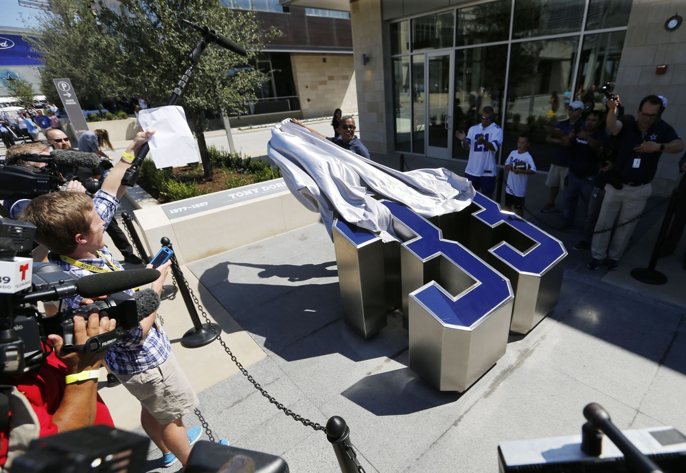 Former Dallas Cowboys running back Tony Dorsett unveils his number in his dedicated area...