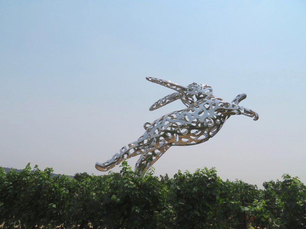 A 35-foot-long, stainless-steel leaping rabbit by artist Lawrence Argent greets visitors as...