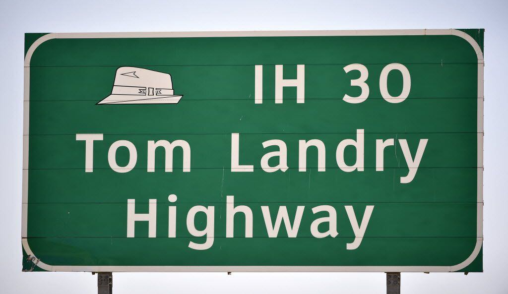 A Tom Landry Highway (IH-30) sign between Grand Prairie, Texas and Dallas, pictured on...