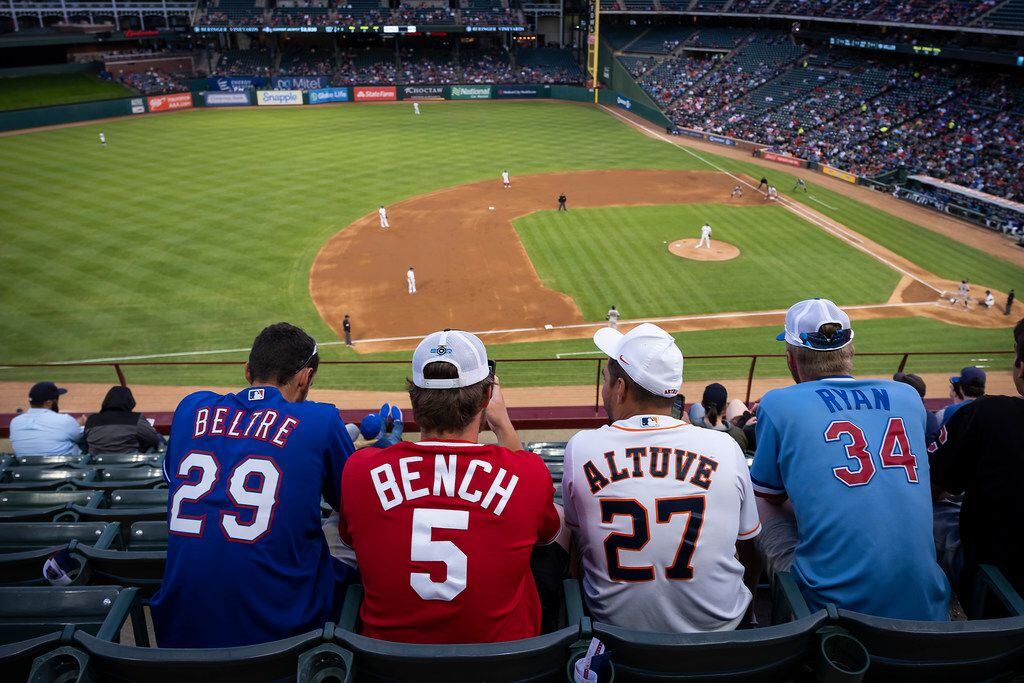 Fans wearing jerseys as varied as, from left, Adrian Beltre, Johnny Bench, Jose Altuve and...