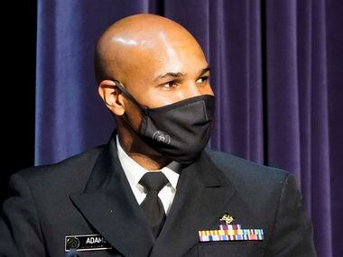 Surgeon General Jerome Adams listens to a speaker during a roundtable conversation about...