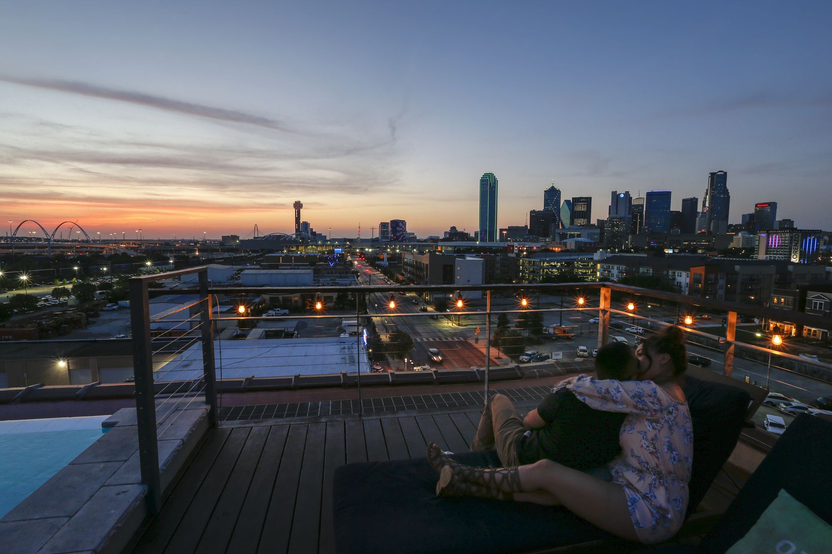 Aurelio Hernandez and Elizabeth Barajas watch the sunset from Nylo Dallas Southside bar in...