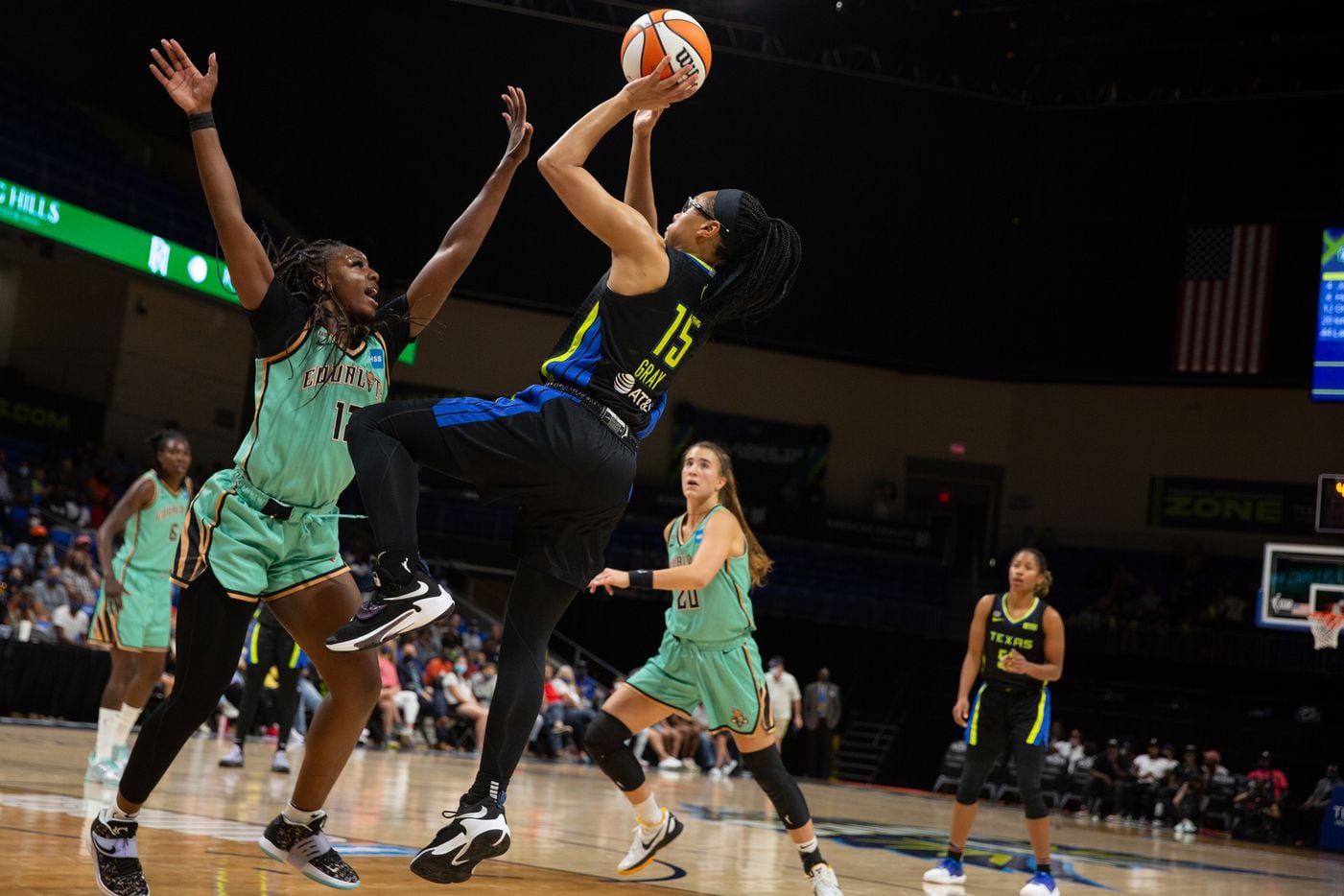 Dallas Wings guard Allisha Gray (15) goes for a fade-away shot during their game against NY...