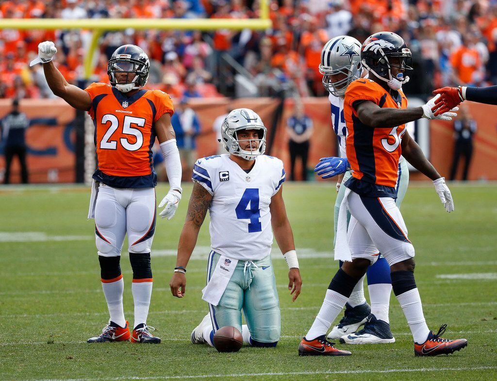 Dallas Cowboys quarterback Dak Prescott (4) reacts after a play in the first quarter at...