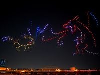 Dallas-based Sky Elements Drone Shows lights up the sky above downtown Dallas with drones depicting Pokémon character Pikachu battling against a Charizard. The drone show will be visible again Friday night ahead of Leonhart's popup event.