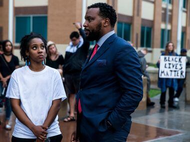 Jean family attorney Lee Merritt talks to Lelani Russell during a Next Generation Action...