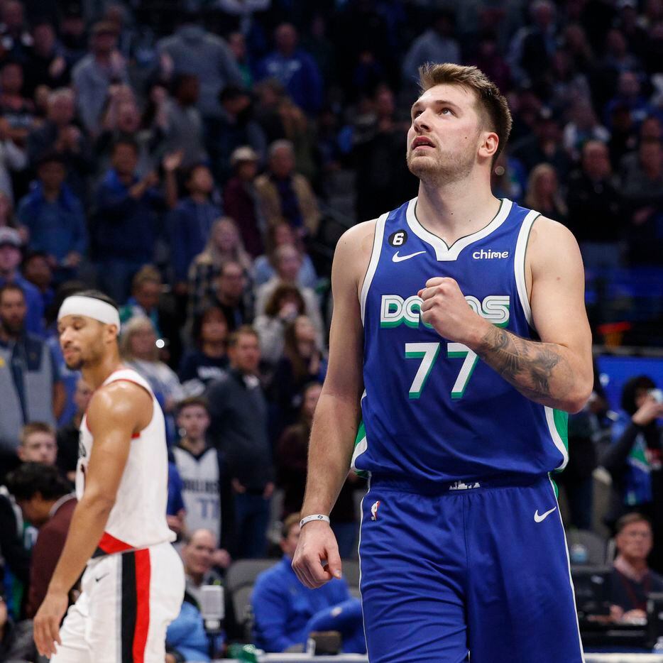Dallas Mavericks guard Luka Doncic (77) celebrates as he  watches the final shot from the...