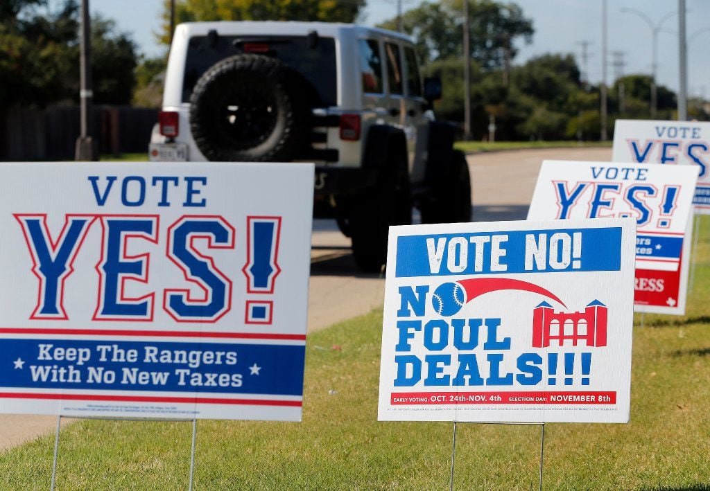 Campaign signs supporting and opposing public assistance for a new Texas Rangers stadium....