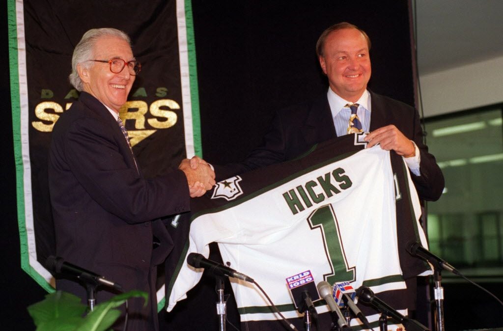 Press conference announcing the  sale of the Dallas Stars. (Left) Norm Green shakes hands...