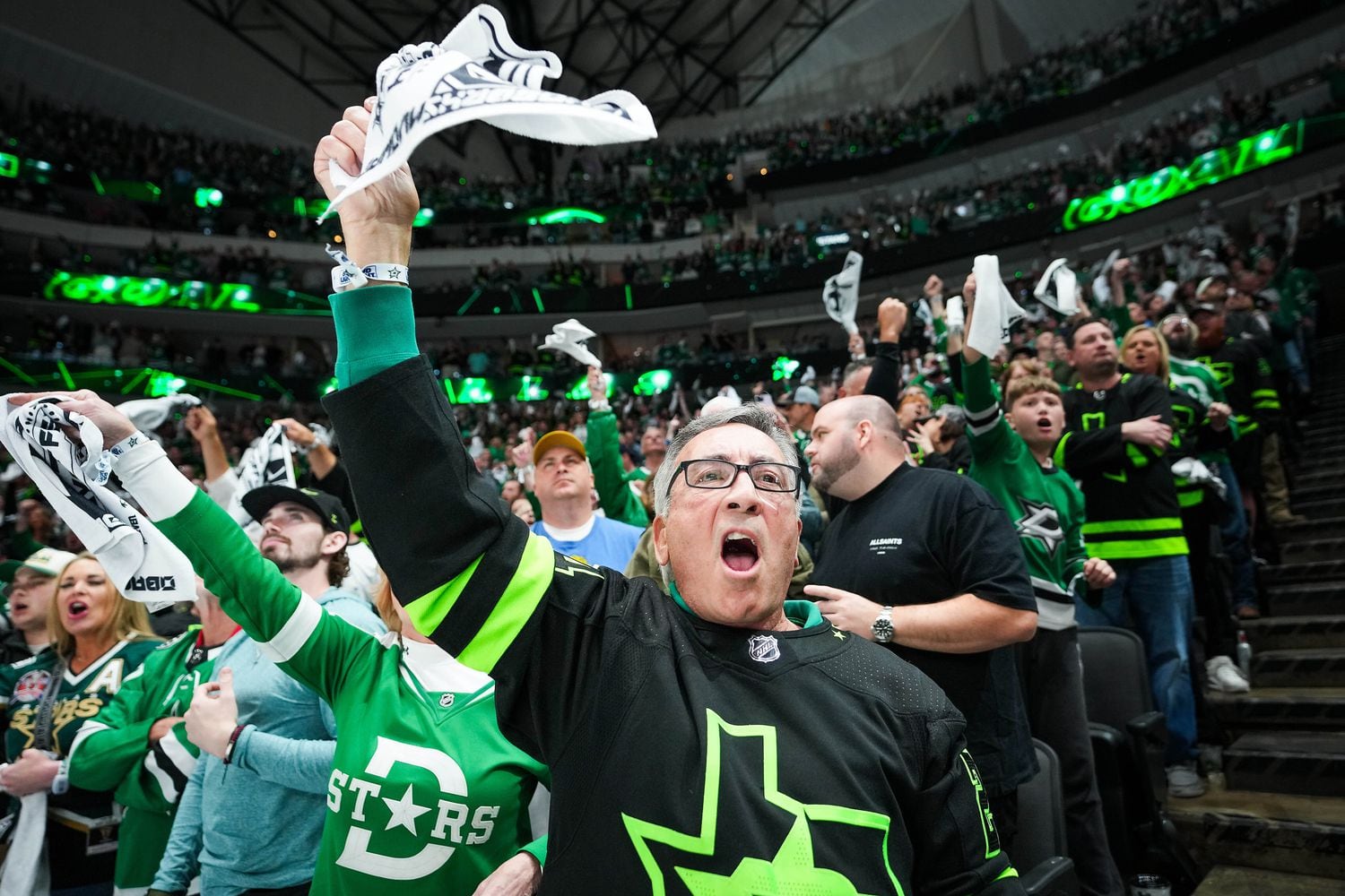 Dallas Stars fan Steve Jebbia cheers after a Stars goal during the second period in Game 5...