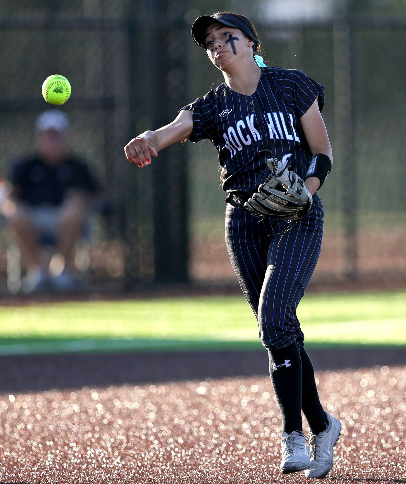 Prosper Rock Hill shortstop Camila Spriggs makes a throw over to first base against Royce...