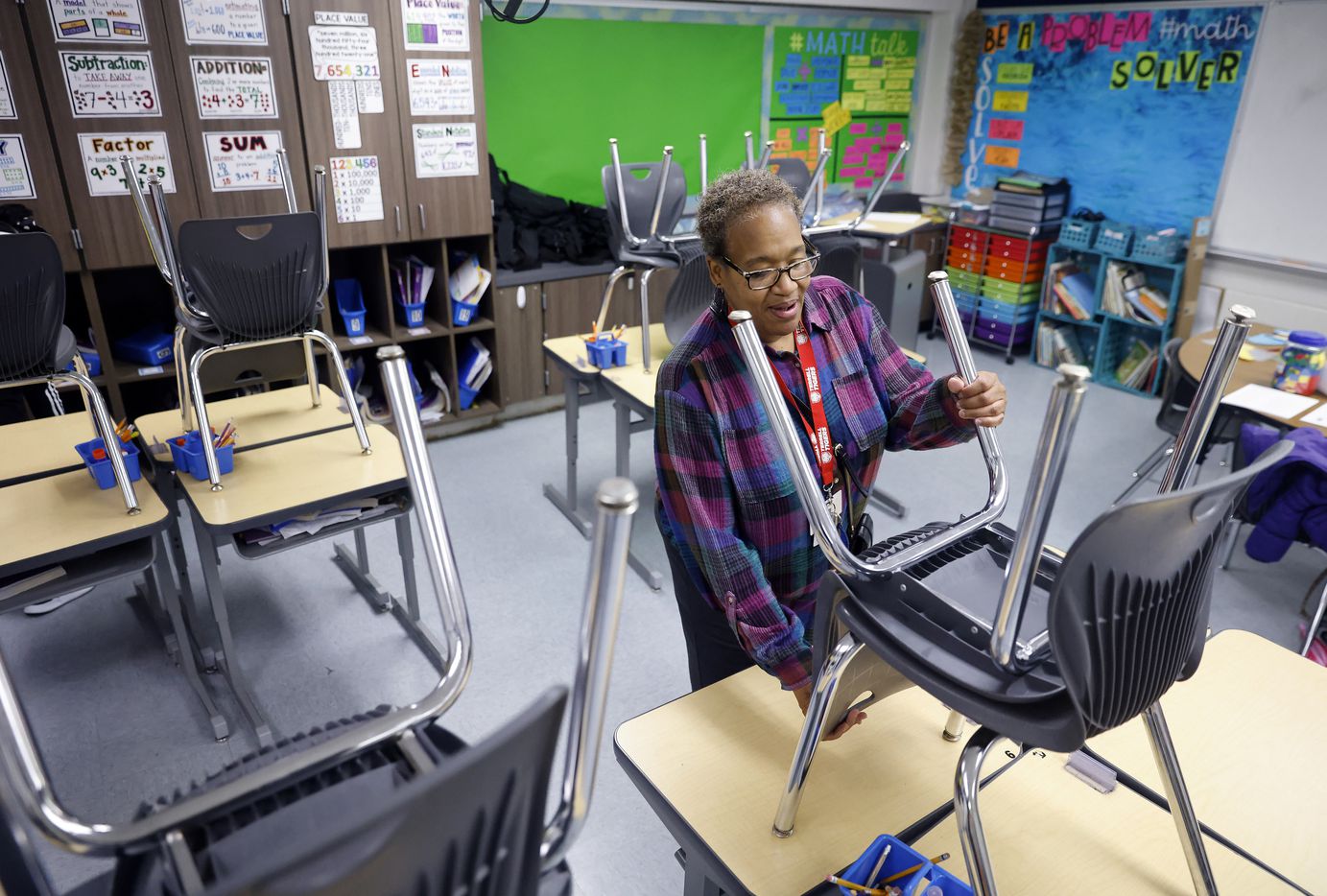 Third grade teacher Schrildea Glover, who also buses kids back and forth to Gilbert Willie...