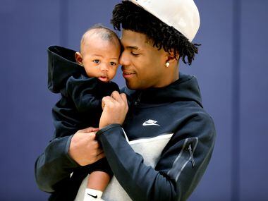 Kendric Davis poses with his 4-month-old son Kendric Jr, at SMU's Moody Coliseum in Dallas, Texas, Friday, Nov. 5, 2021.