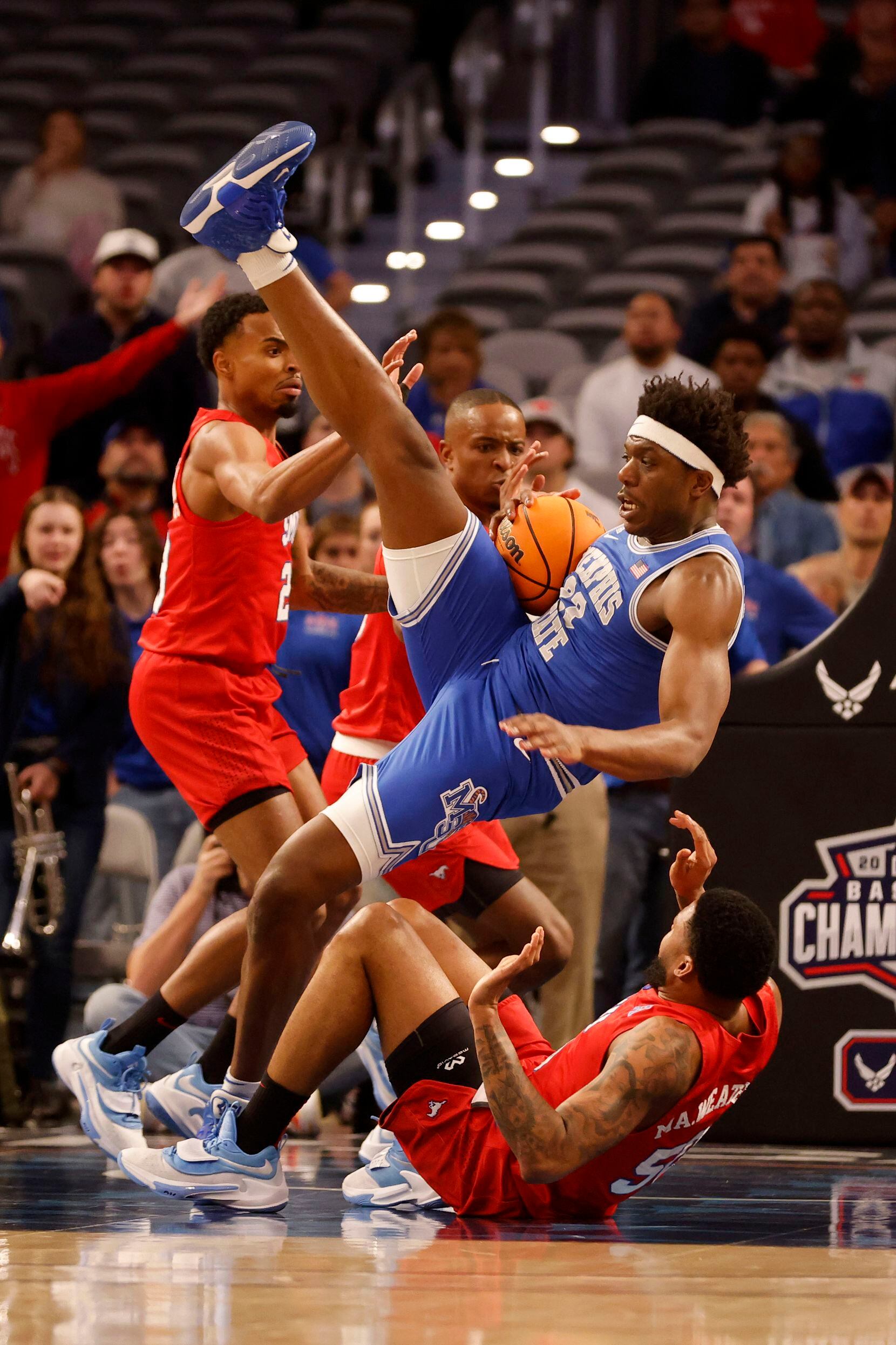 Memphis center Malcolm Dandridge (23) is fouled by SMU forward Marcus Weathers (50),on...