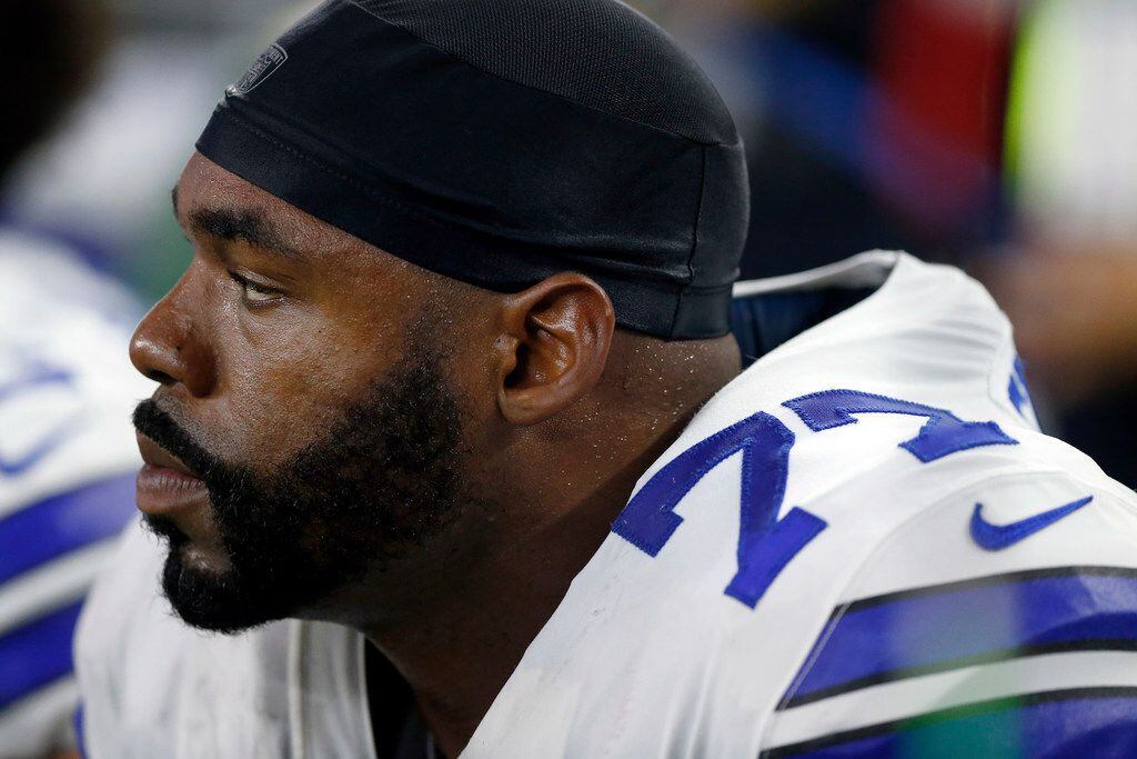 Dallas Cowboys offensive tackle Tyron Smith (77) is pictured on the bench during the second...