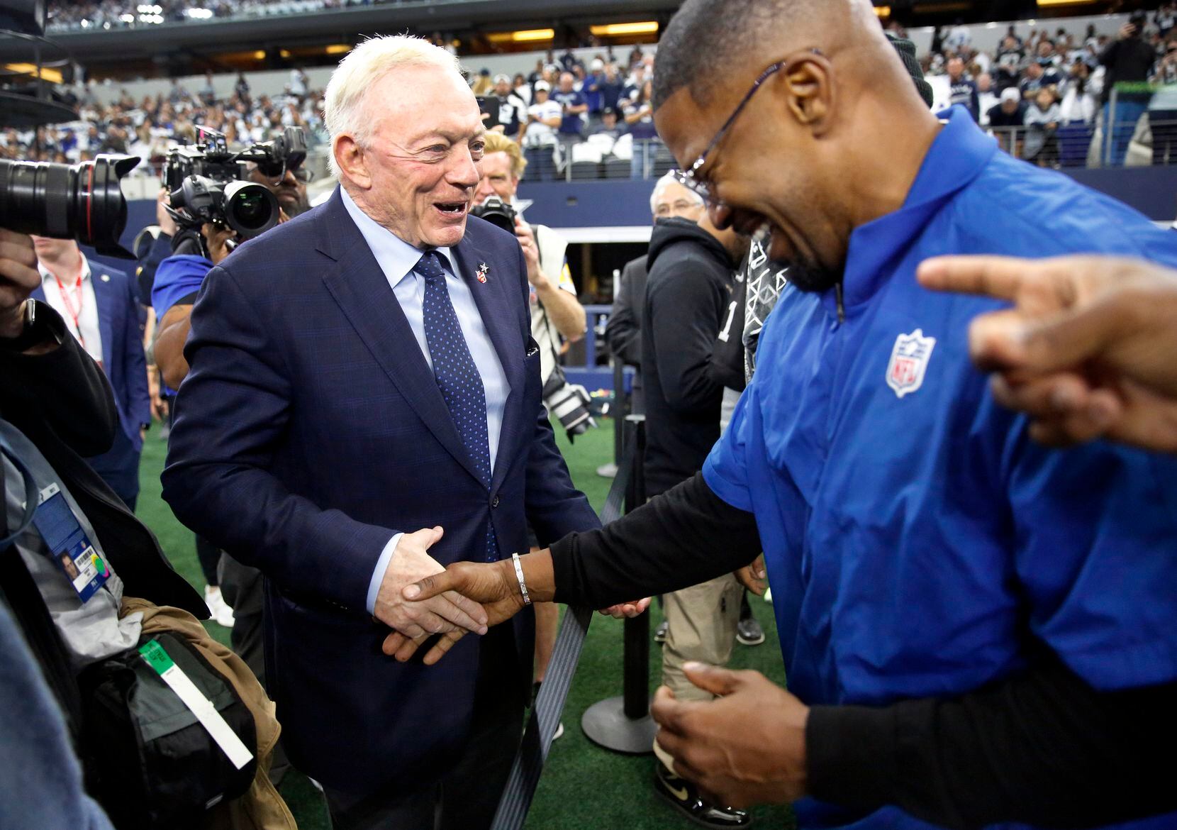 Dallas Cowboys owner Jerry Jones (left) jokingly tells actor Jamie Foxx to get in the game as they meet during pregame warmups at AT&T Stadium in Arlington, November 25, 2021. The Cowboys were facing the Las Vegas Raiders on Thanksgiving Day. (Tom Fox/The Dallas Morning News)