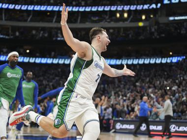 Mavericks Dallas quarterback Luka Doncic (77) celebrates his 3-point buzzer after the Mavericks claimed a 107-104 victory over the Boston Celtics on Saturday, Nov. 6, 2021, in an NBA basketball game at the American Airlines Center.  Dallas.