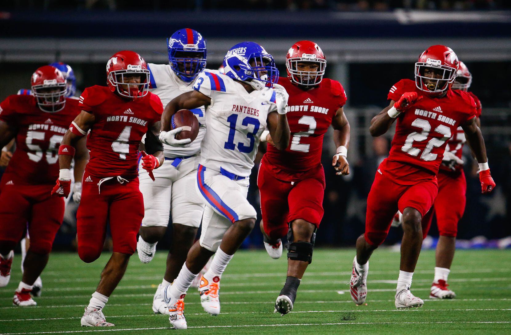 Duncanville's Roderick Daniels	(13) tries to outrun North Shore's defense during the third...