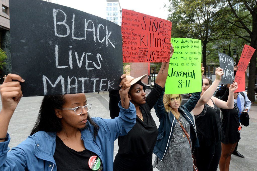 College students in Charlotte, N.C., protest the deadly police shooting in their city.