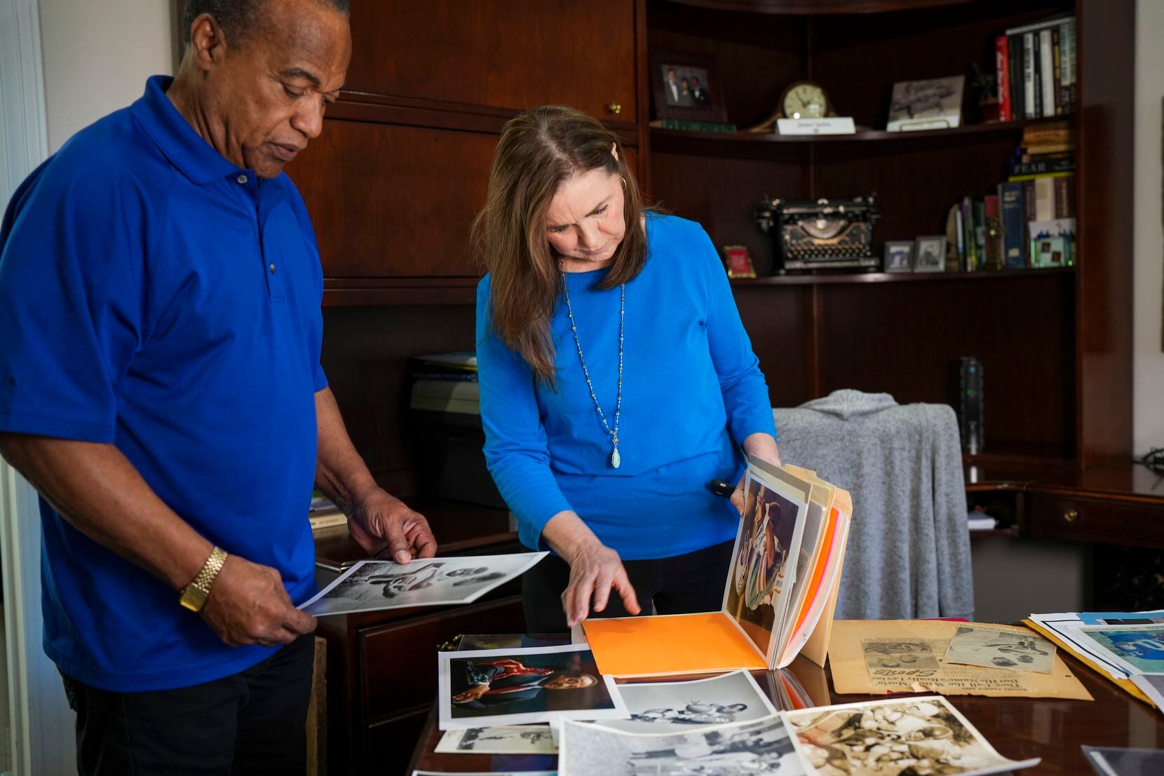 LeVias and his wife, Janice, flip through old photos at their home on Thursday, Jan. 5, 2023.