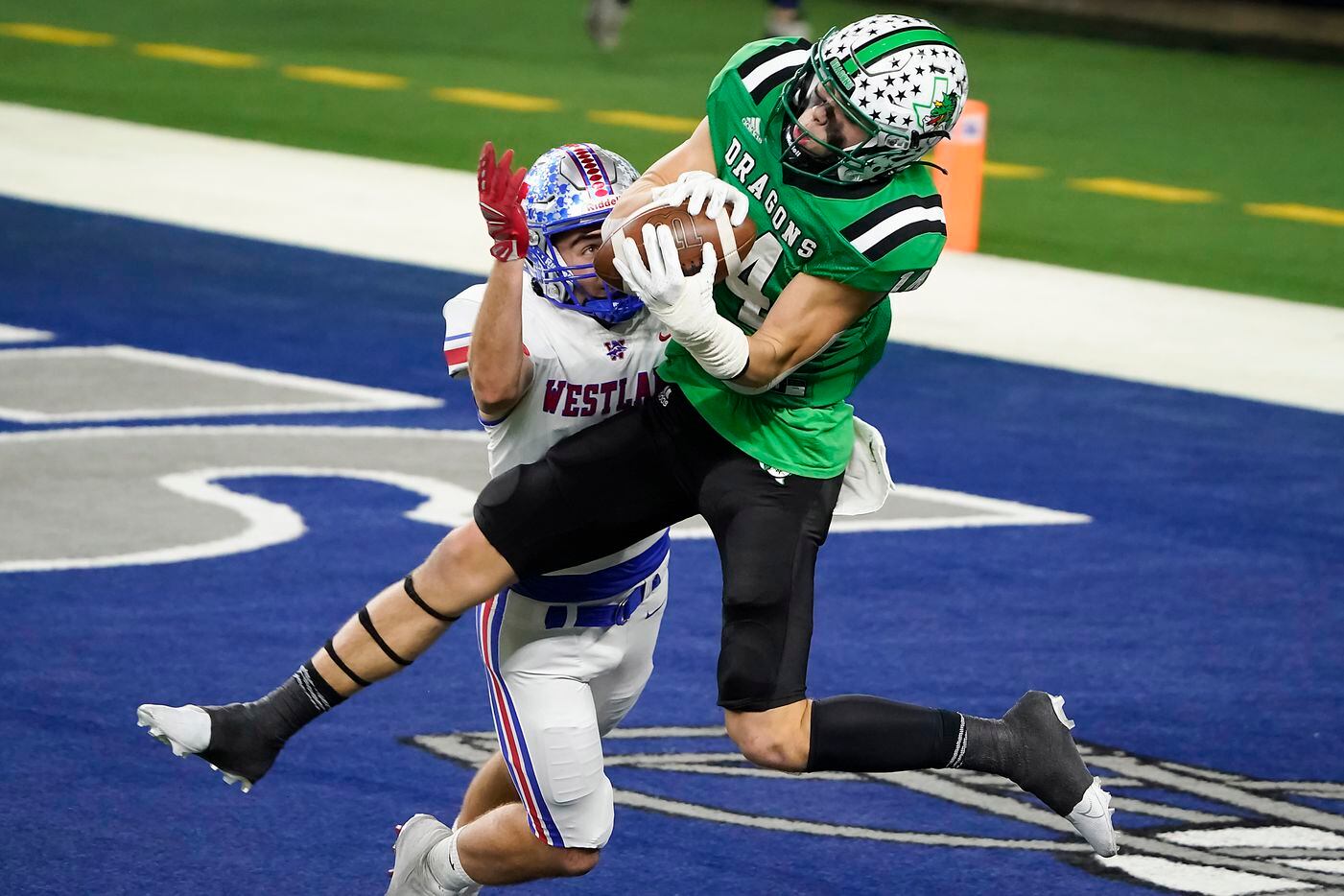 Southlake Carroll wide receiver Brady Boyd (14) catches a 27-yard touchdown pass as Austin Westlake defensive back Jax Crockett (4) defends during the second quarter of the Class 6A Division I state football championship game at AT&T Stadium on Saturday, Jan. 16, 2021, in Arlington, Texas. (Smiley N. Pool/The Dallas Morning News)