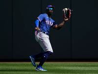 Texas Rangers right fielder Adolis Garcia (53) catches a fly ball hit by Arizona...