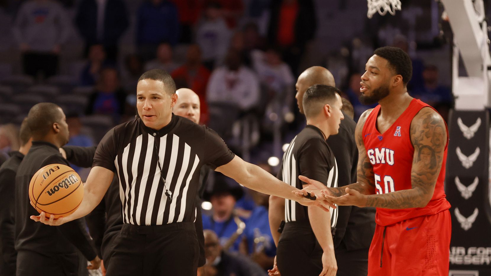 SMU forward Marcus Weathers (50) argues with a referee as they played Memphis during the...