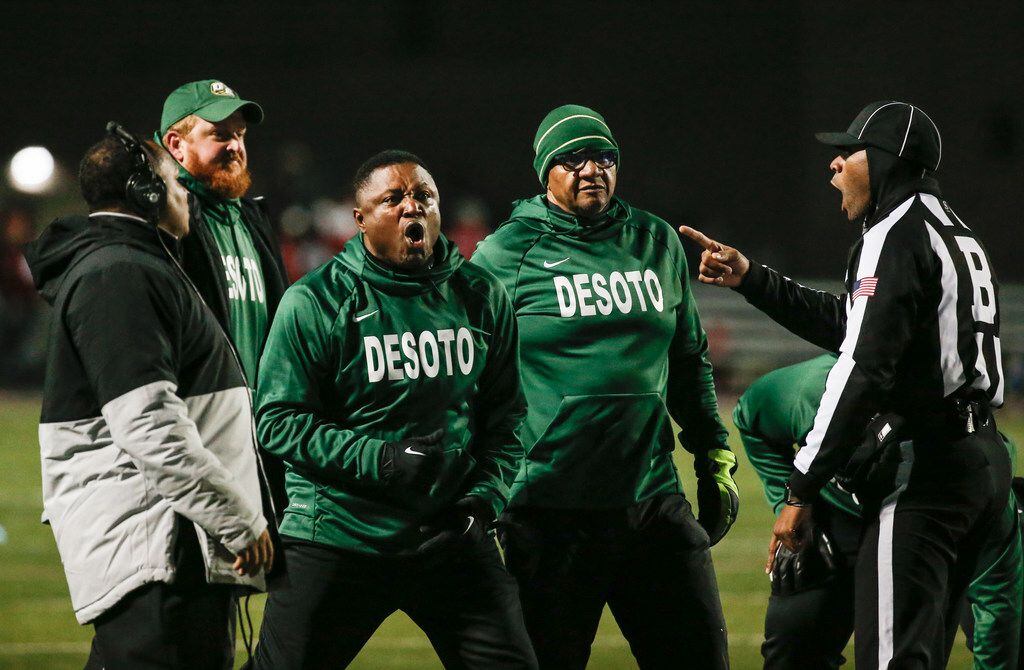 DeSoto head coach Claude Mathis disputes an official's call during a high school football...
