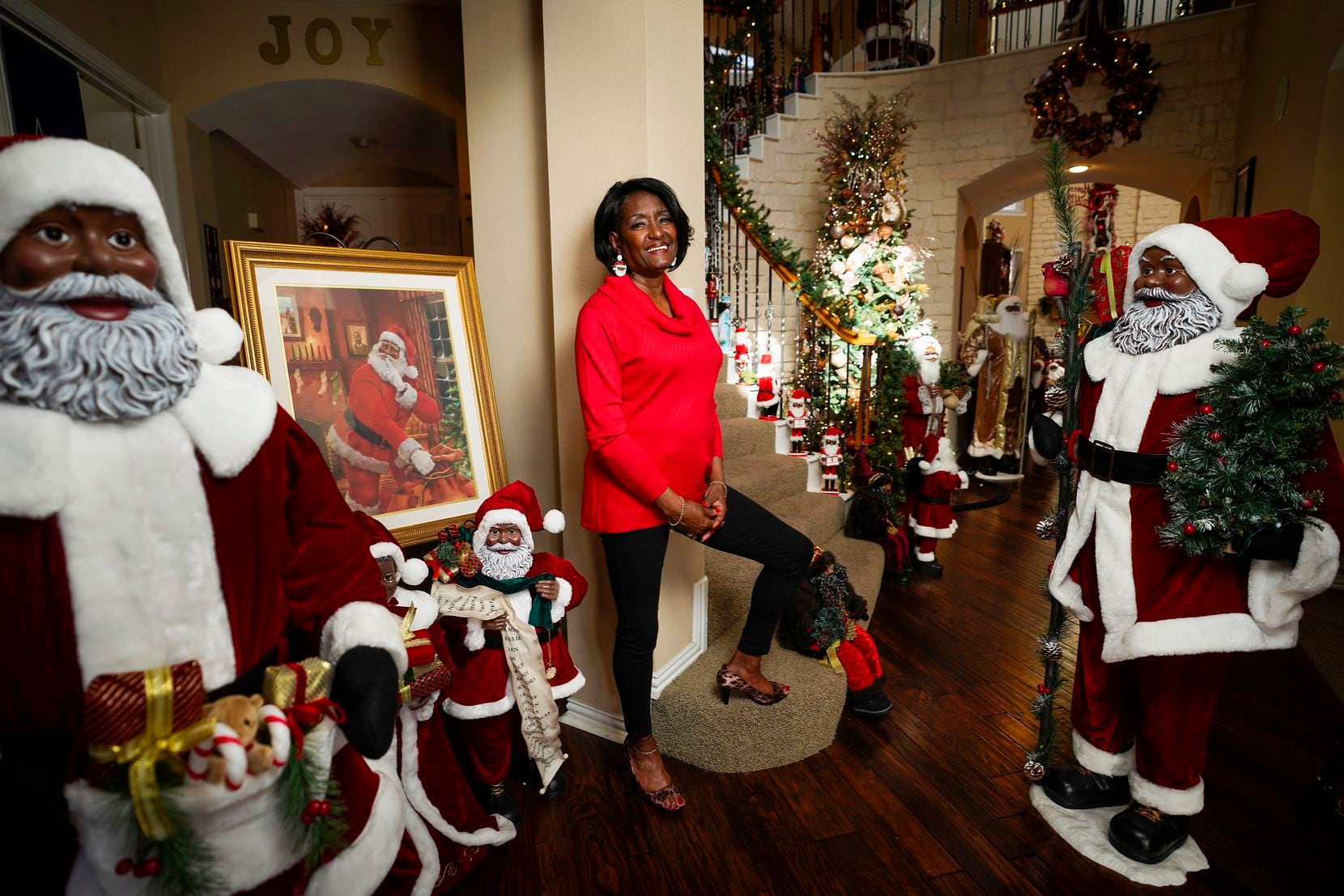 Visitors to Pat Hamilton's DeSoto home are first greeted by her Hall of Black Santas.