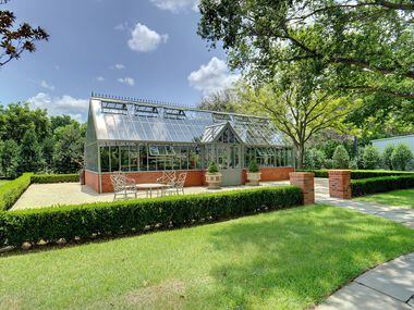 The classically-styled greenhouse on the property at 6401 Westcoat Drive in Colleyville has...