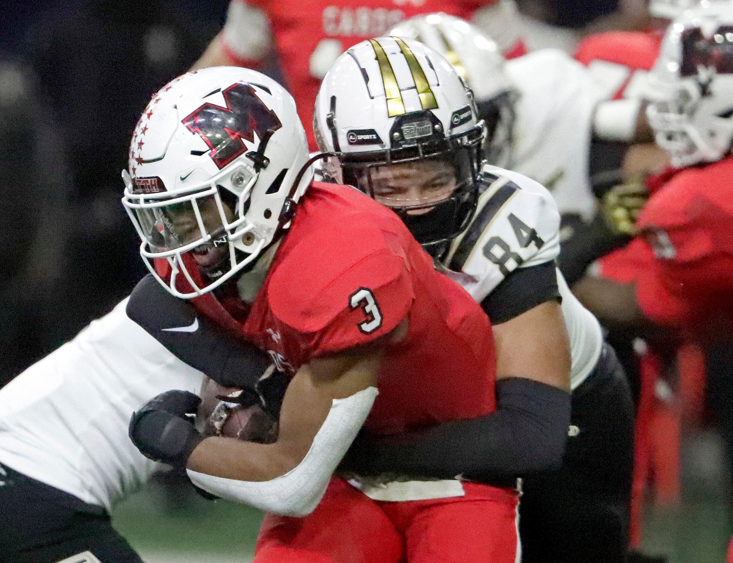 Melissa High School running back Nathan Adejokun (3) is tackled by South Oak Cliff High...